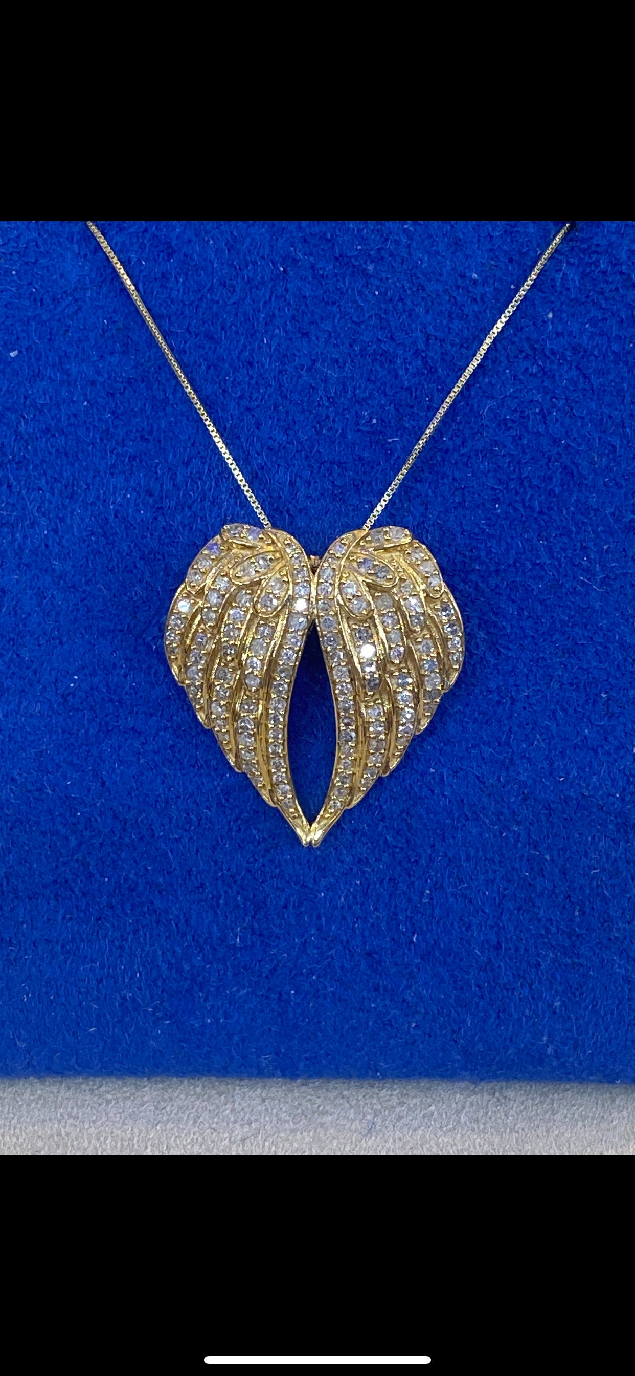 Simple yet stylish angel wing pendant is set with simulated diamonds in  sterling silver bonded with platinum The pendant comes on an adjustable 18  inch chain - Diamond & Design